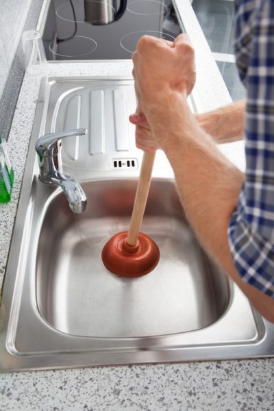 Plunging a blocked kitchen sink
